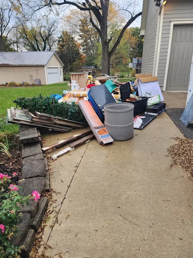 Dumpster being loaded with debris for 10 Yard Dumpster Rental in Posen